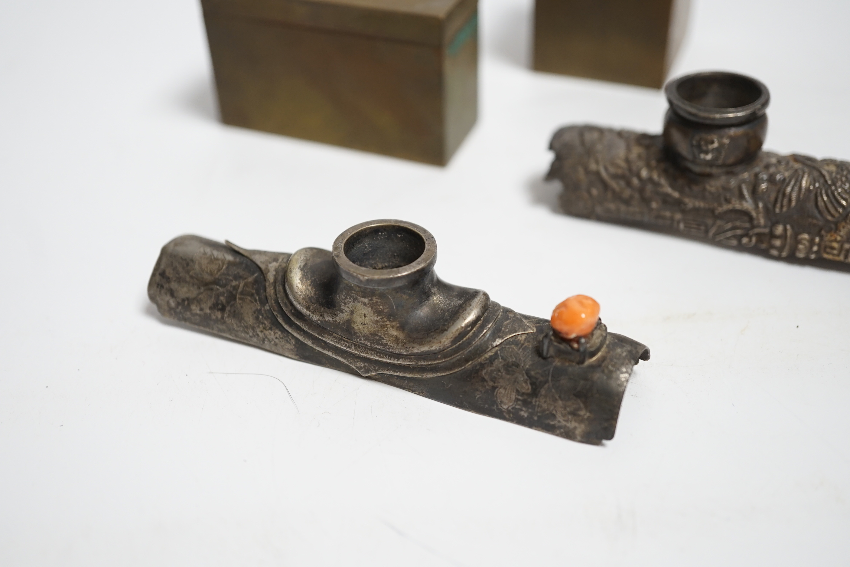 Two white metal opium pipe heads and two opium boxes (mid 20th century)
